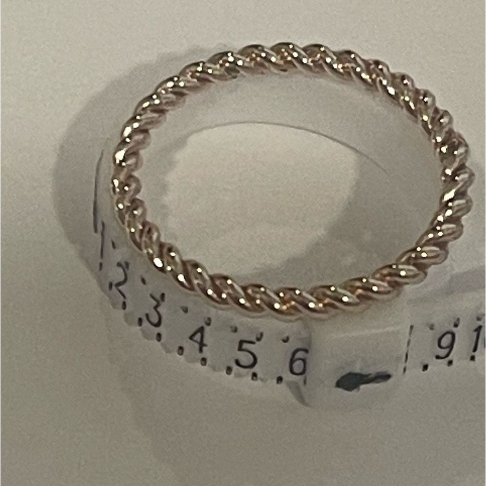 Gold toned twist ring​​​​​​​​